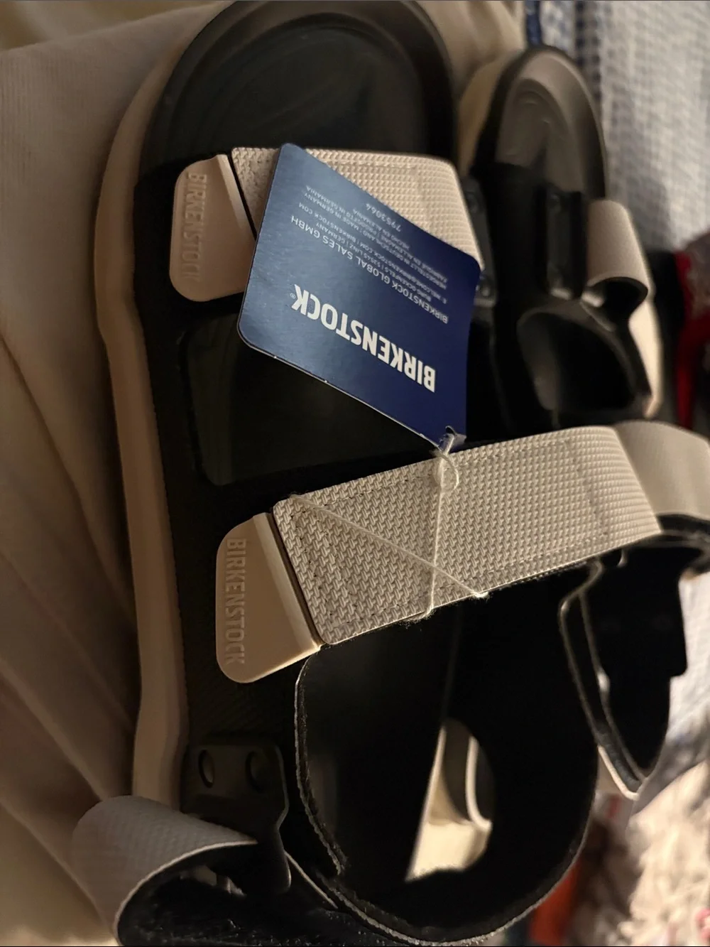 Birkenstock Black Sandals with White Straps and Adjustable Buckles